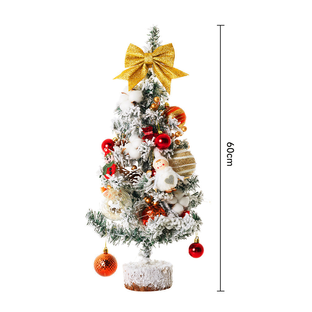 Miniature Christmas tabletop tree with LED lights, Garden Sanctuary brand, decorated for festive holiday decor.