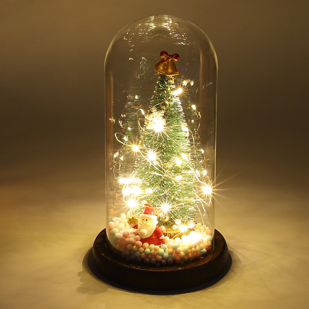 LED glass dome Christmas tree tabletop decoration by Garden Sanctuary with a festive lit tree inside a clear glass dome.