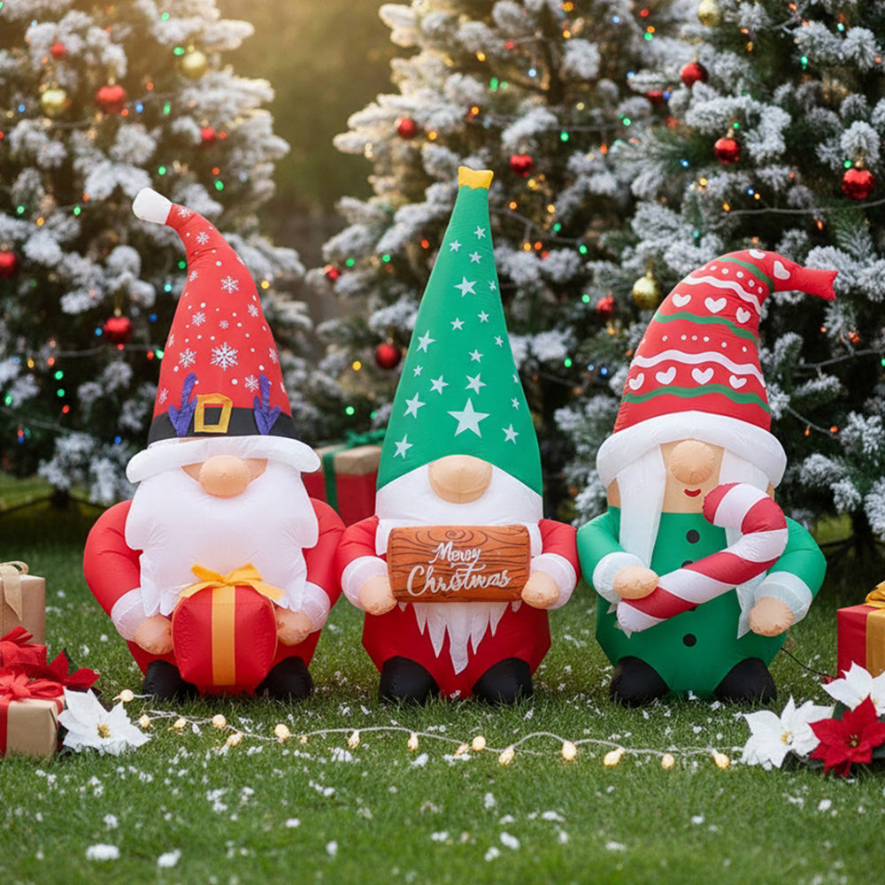 Garden Sanctuary Christmas inflatable gnome trio with LED lights, festive outdoor decoration featuring three cheerful gnomes with illuminated accents.
