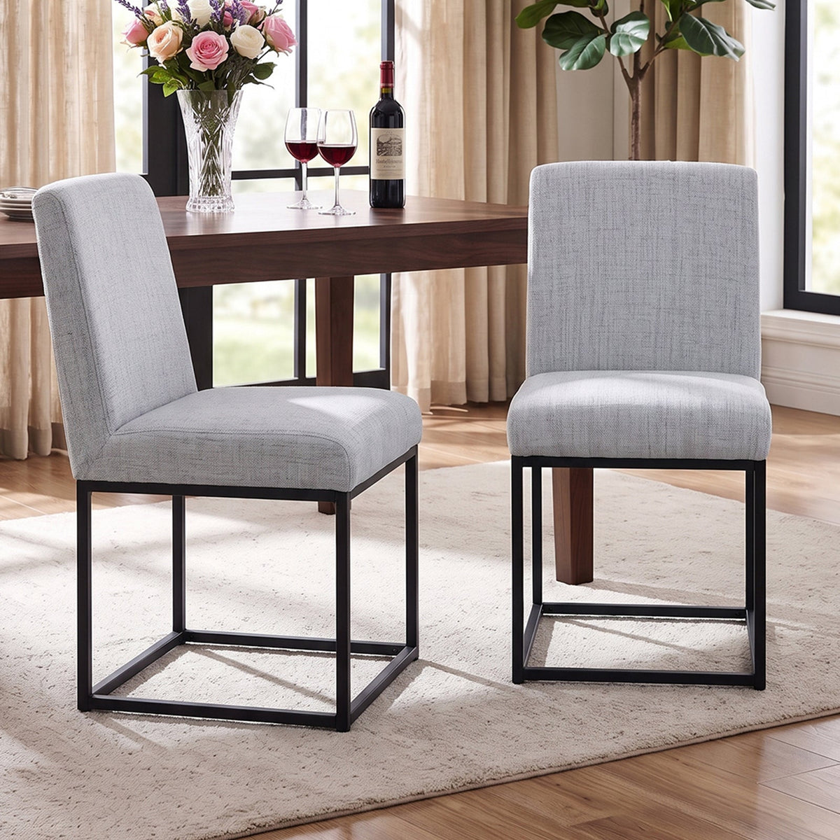 Two chenille upholstered dining chairs with black metal legs, featuring a modern design for comfortable seating.