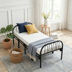 Garden Sanctuary metal folding bed frame with secure buckle design, showing the sturdy frame and compact folded position.